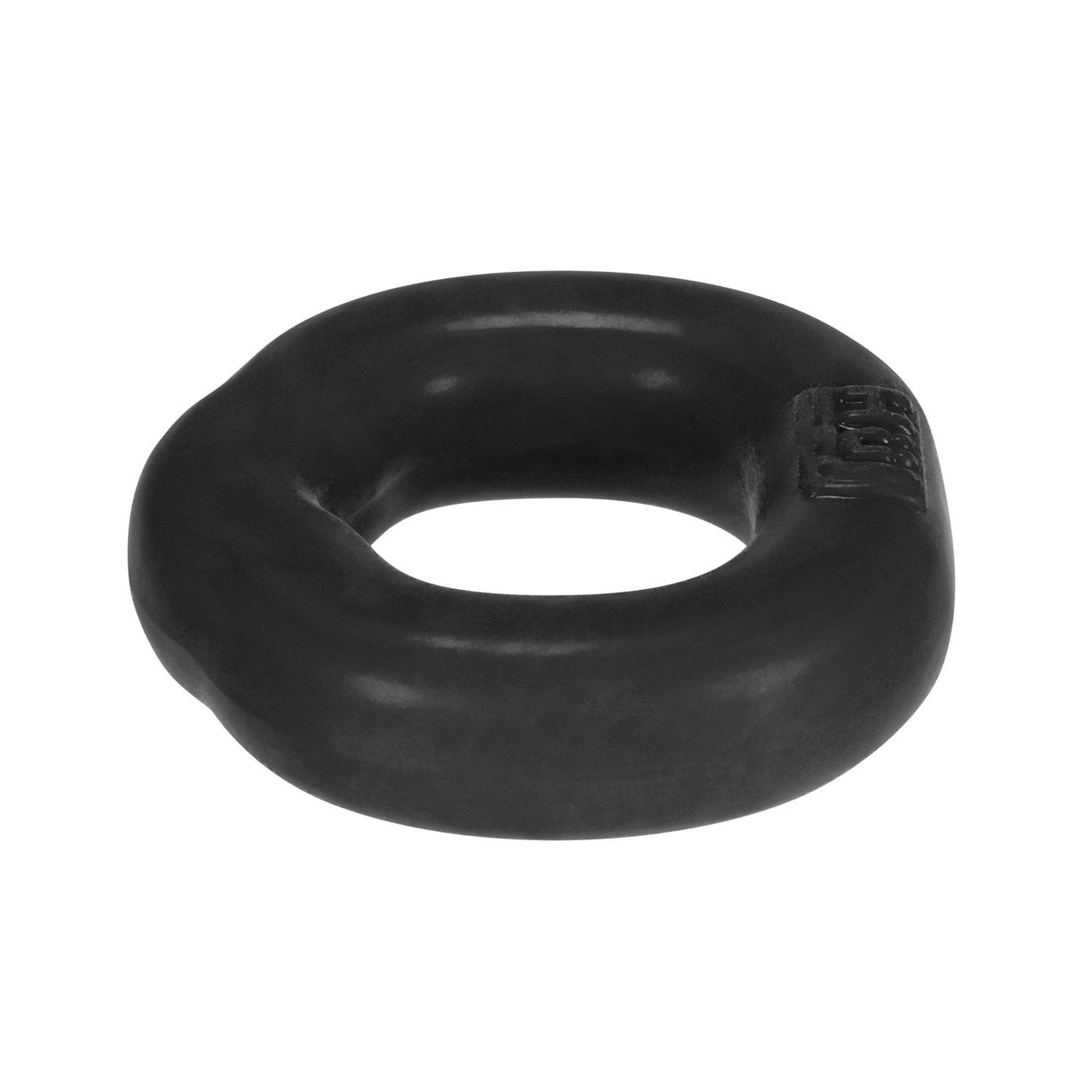 The Hunky Junk Fit Ergo C Ring by Hunky Junk is a black, smooth, donut-shaped rubber object with a slightly irregular surface that ensures an ergonomic fit.