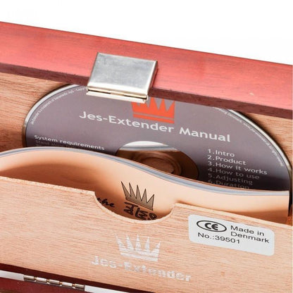 The Jes Extender Original Standard Penis Enlarger Kit comes in a wooden box with a secure metal clasp, containing both a manual on CD and a booklet. The elegantly crafted storage bears the Made in Denmark label, offering discreet storage for your penis enlargement journey.