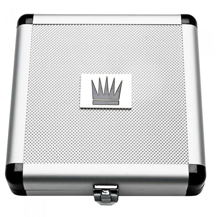 A silver and black metal case with a textured surface includes a square crown emblem in the center of the lid. The Jes Extender Titanium Penis Enlarger Kit, by Jes, fits snugly inside and is secured with a front latch.