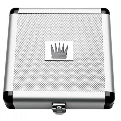 A silver and black metal case with a textured surface includes a square crown emblem in the center of the lid. The Jes Extender Titanium Penis Enlarger Kit, by Jes, fits snugly inside and is secured with a front latch.