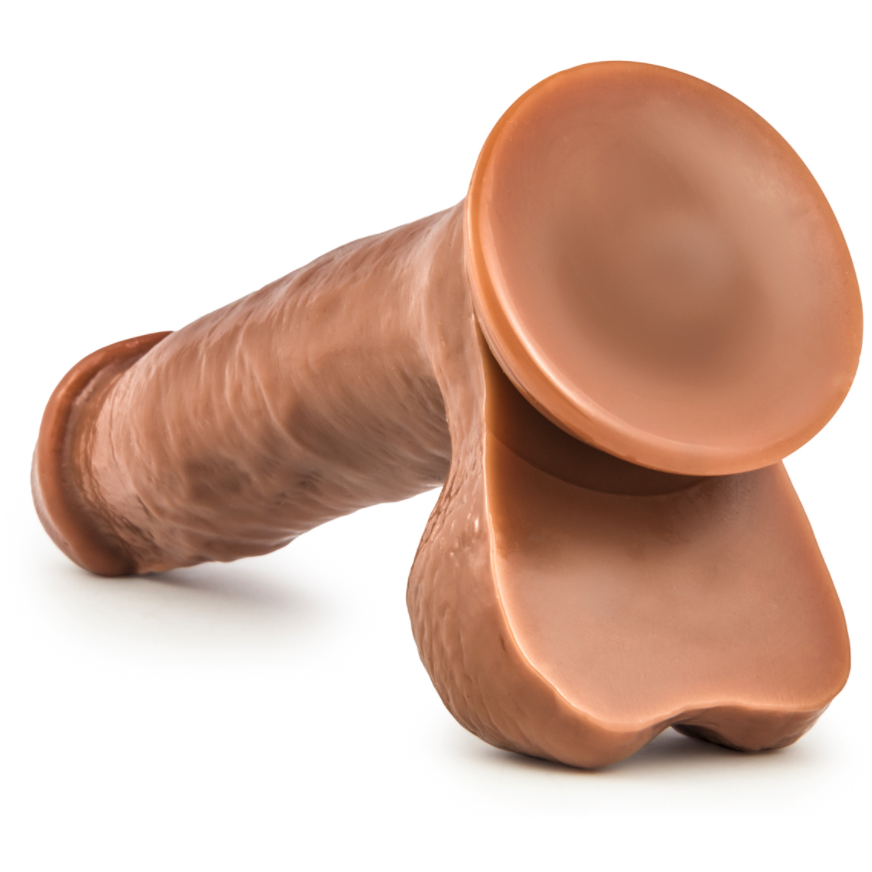 The Loverboy 5.5 The Kingpin by Blush Novelties is a realistic, chocolate-colored novelty item shaped like an oversized nut and bolt. It features detailed textures and a shiny surface, making it a striking and unique piece of quirky decor that captures attention.