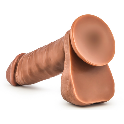 The Matador by Blush Novelties is a hyper-realistic 6.25 silicone dildo with lifelike texture, anatomical design, cylindrical shape, natural skin tone, and detailed features. It includes a secure rounded base and versatile suction cup for varied placement.