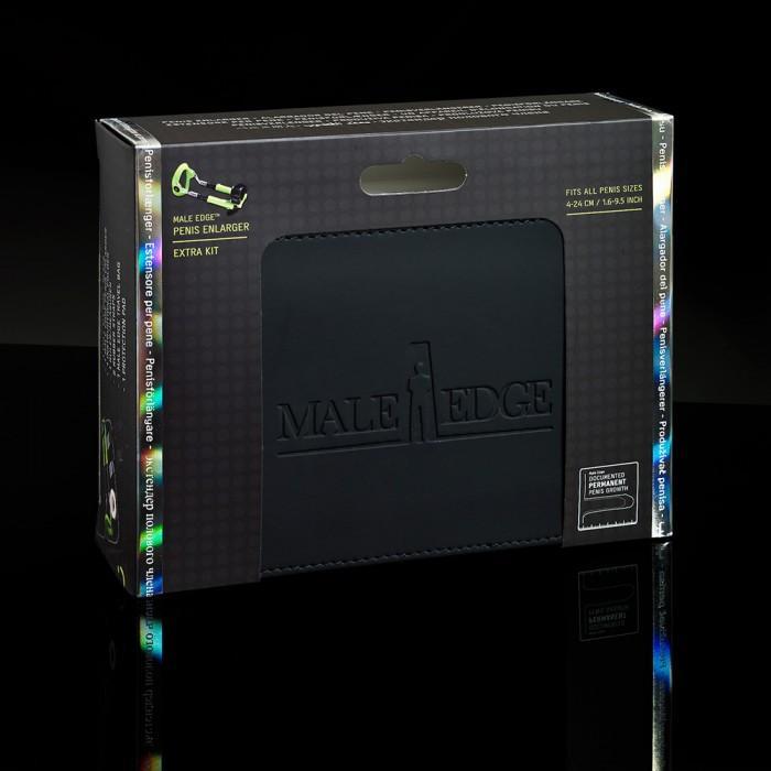 The Male Edge Extra Penis Enlarger Kit features sleek packaging with a dark box and holographic accents. A cutout highlights the product name, showcasing the innovative Male Edge program for effective results.