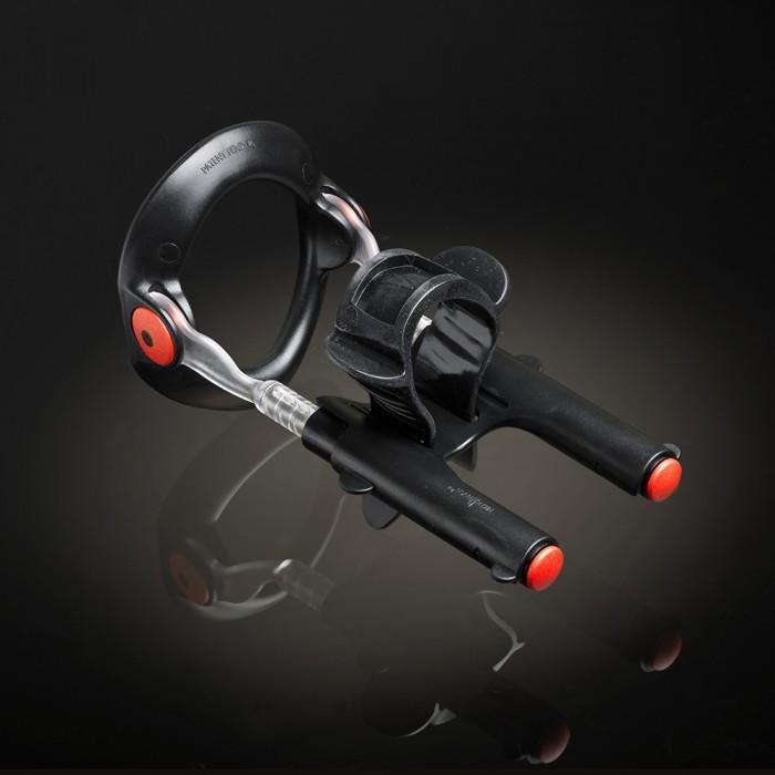 The Male Edge Pro Penis Enlarger Kit by Male Edge features a sleek black and silver design, with dual handles accented by red tips. It uses advanced traction technology and includes a circular section, set against a dark background.