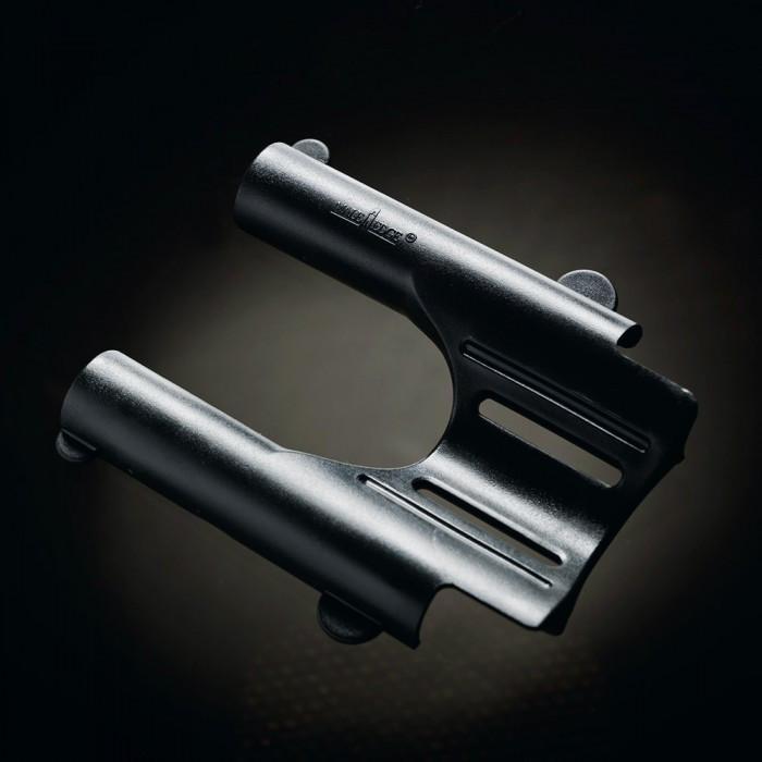 A close-up of the Male Edge Pro Penis Enlarger Kit, a sleek black ergonomic tool with curved edges and slots, highlights its advanced traction technology. The softly illuminated dark background reflects the precision engineering of this Male Edge product.