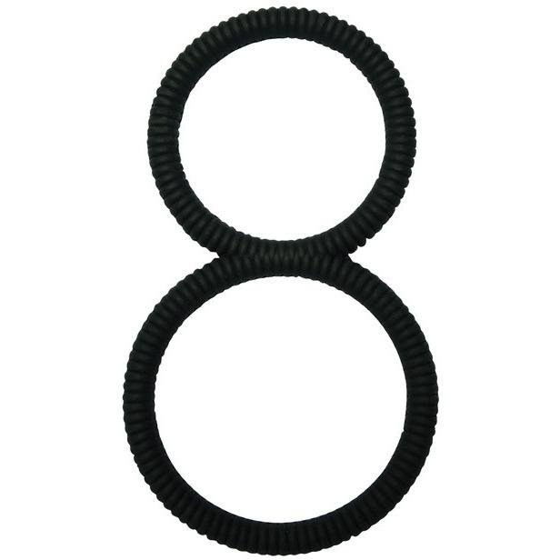 Two black, ribbed circular hair ties are vertically aligned and touching each other on a white background, resembling the shape of a Malesation 8 Ball C-Ring.