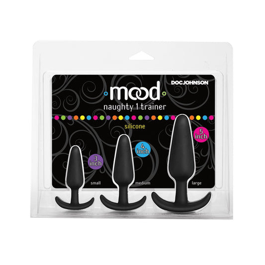 The Mood Naughty 1 Anal Trainer Set by Doc Johnson, featuring a comprehensive kit of three black silicone butt plugs labeled small, medium, and large, comes in packaging adorned with decorative swirls.