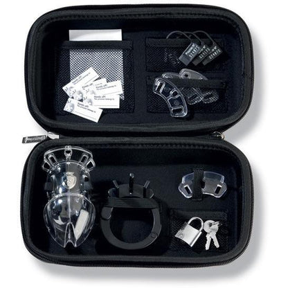 The Mystim Pubic Enemy #1 Cock Cage by Adams Toy Box includes a transparent, adjustable cage, plastic rings, metal locks with keys, and user instructions inside a black zippered case organized with mesh pockets for secure storage.