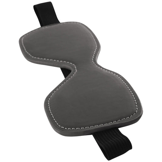 A gray NS Novelties Renegade Bondage Blindfold with white stitching and a black elastic strap is displayed against a white background, resembling a subtle fetish accessory. The contoured design offers comfort and support during your travels.