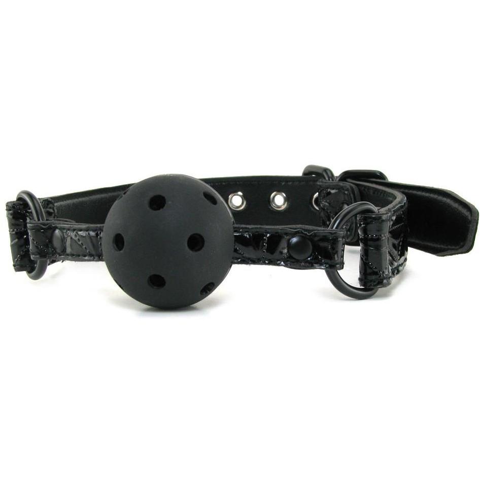 The NS Novelties Sinful Ball Gag features ventilation holes and an adjustable neoprene strap, offering a sleek black finish with multiple silver buckle holes and sturdy metal rings for secure fastening.