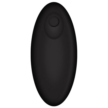 The OptiMale Vibrating P Massager with Wireless Remote by Adams Toy Box features a sleek, black, oval-shaped remote with a round button on top. Its smooth, minimalist design complements the massager for an enhanced experience.