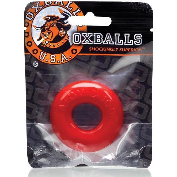 A packaged Oxballs DO-NUT-2 Cock Ring shows a red, circular item through the plastic. With a bull graphic and Oxballs U.S.A., this body-safe cock ring, crafted from top-quality FLEXXX TPR, ensures exceptional quality.