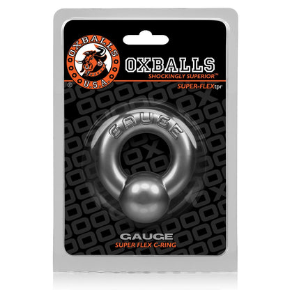 The Oxballs Gauge Cockring, made from SuperFLEXtpr, comes elegantly packaged with a black background featuring the Oxballs logo and Shockingly Superior tagline. This Super Flex C-Ring is ideal for those seeking alternatives to traditional penis piercing jewelry.