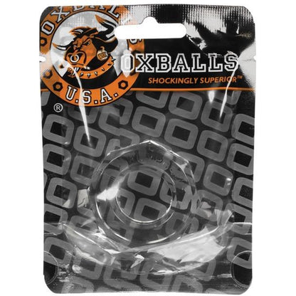 The Oxballs Humpballs Cockring is a clear ring packaged in a plastic bag featuring the Oxballs logo and Shockingly Superior text. Made from SkinFlex-TPR, it provides a tight grip with a stylish geometric backdrop.