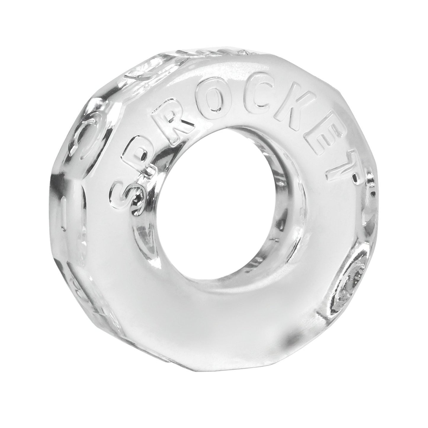 The Oxballs Sprocket Cockring, by Oxballs, is a clear glass octagonal item with a central hole, resembling a large nut or washer. It features the embossed word SPROCKET on its surface and boasts durability similar to body-safe TPR material.