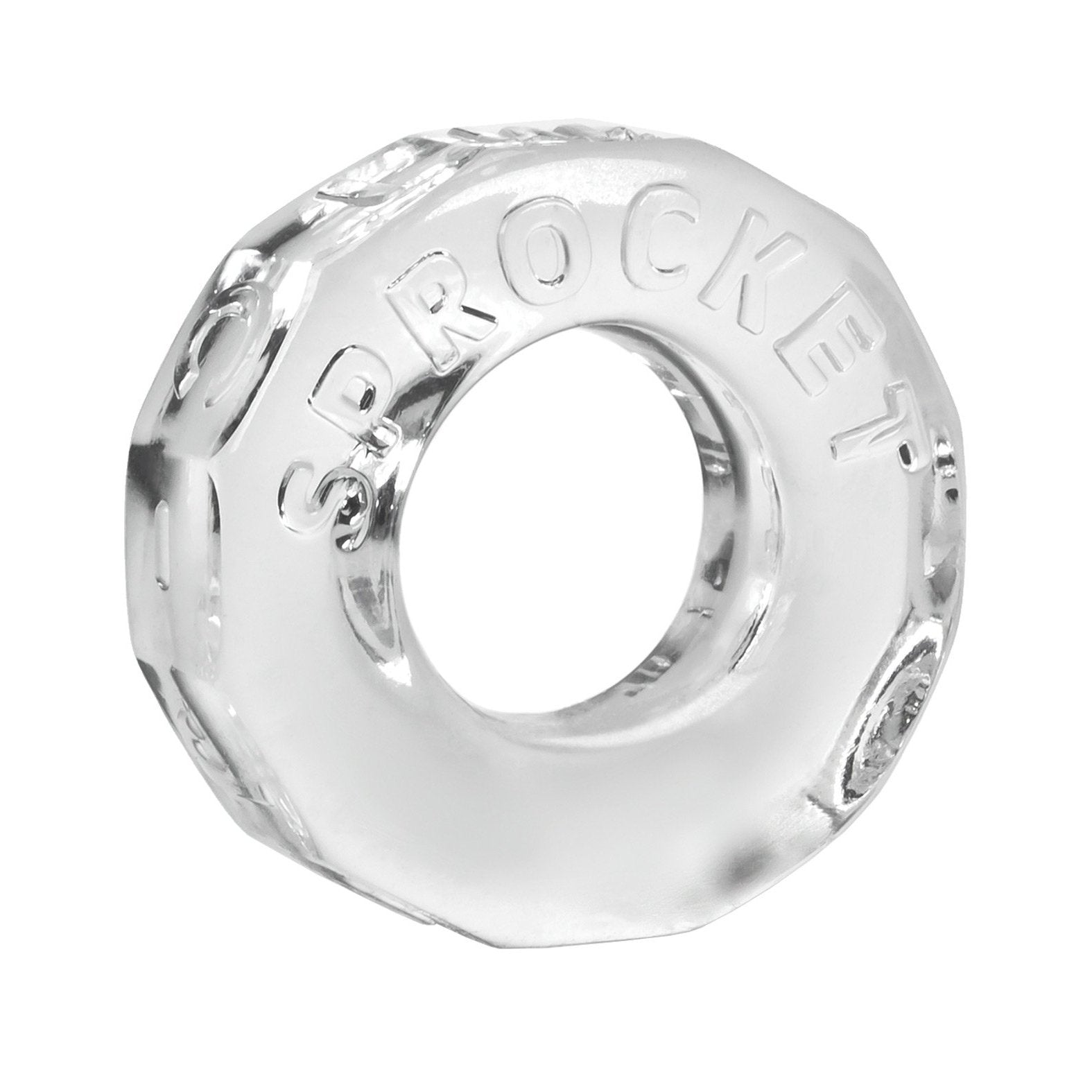 The Oxballs Sprocket Cockring, by Oxballs, is a clear glass octagonal item with a central hole, resembling a large nut or washer. It features the embossed word SPROCKET on its surface and boasts durability similar to body-safe TPR material.