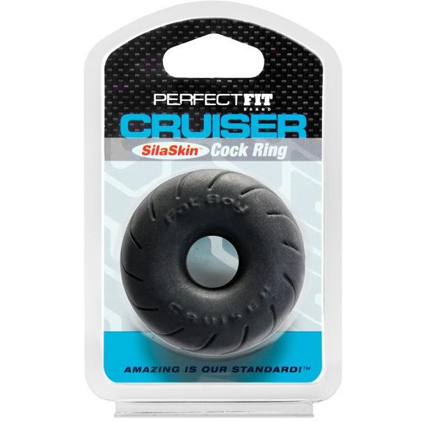 The Perfect Fit Cruiser Cock Rings packaging highlights its black, donut-shaped design with the brand embossed. Made from super stretchy SilaSkin, it features a blue base with the phrase: Amazing is our standard!.
