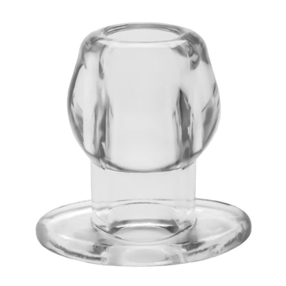 The Perfect Fit Large Tunnel Plugs innovative design resembles a clear glass candle holder with a short stem and wide base. It elegantly holds one candle, and its transparent material reflects light to showcase its smooth texture.