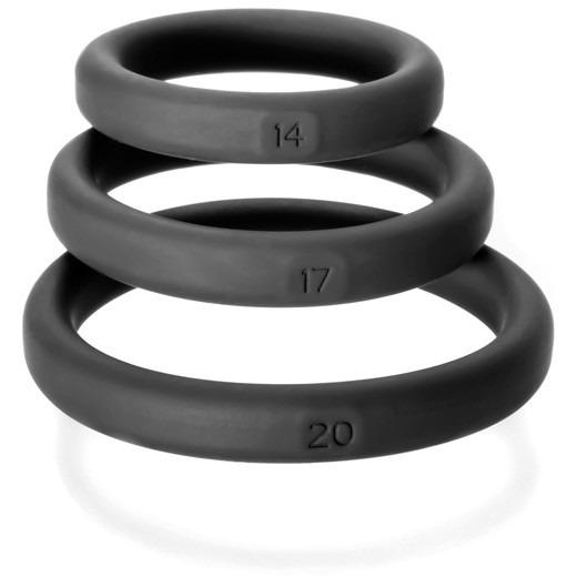 The Perfect Fit Xact Fit 3 Ring Kit by Perfect Fit includes three black silicone rings, each numbered 14, 17, and 20, designed for a perfect fit. These rings help support longer-lasting erections with sizes increasing from top to bottom.