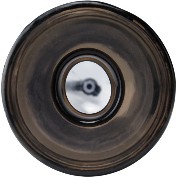 Close-up of a metallic circular object, resembling a large lens or industrial component, with a reflective surface and central focal point. Its glossy appearance mirrors the sleek design found in modern tools like the Pump Worx Max Width Penis Enlarger by Adams Toy Box.
