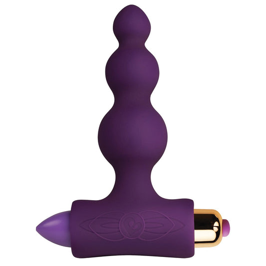 The Rocks Off Petite Sensations Bubbles from Adams Toy Box is a purple anal plug made of ultra-soft silicone with three graduated spheres. A gold-accented bullet vibrator at the base offers 3 vibration speeds for versatile, personal use.
