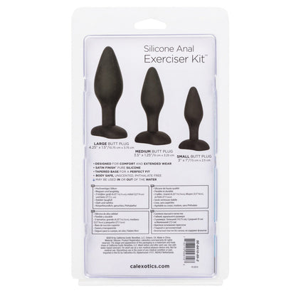The back packaging of California Exotic Novelties Silicone Anal Exerciser Kit highlights features of three phthalate-free black butt plugs—small, medium, large—with a flanged base and dimensions presented in various languages.