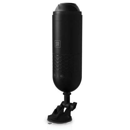 The Sir Richards Control Power-Bator by Adams Toy Box is a black cylindrical device with a textured grip, branded SR. It features a sleek, modern design and comes with an adjustable stand and removable suction cup, making it ideal for desktop use.