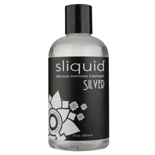A clear bottle of Sliquid Naturals Silver silicone intimate lubricant with a black label featuring white text and decorative patterns, detailing the product name, size (8.5 oz/255 ml), and noting it is paraben-free and vegan-friendly.