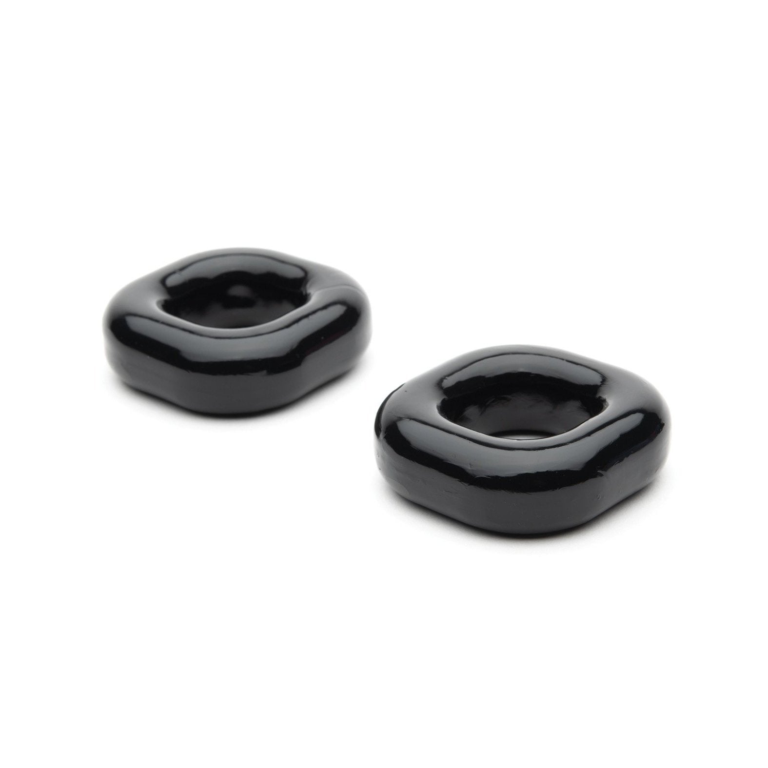 Two sleek, modern black ceramic rings with a square-rounded shape rest on a plain white background, reminiscent of the elegant Sport Fucker Boner Expansion Kit.