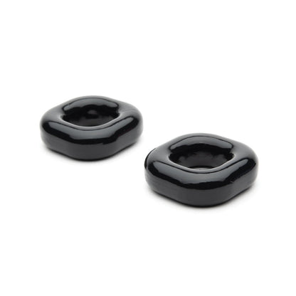Two sleek, modern black ceramic rings with a square-rounded shape rest on a plain white background, reminiscent of the elegant Sport Fucker Boner Expansion Kit.