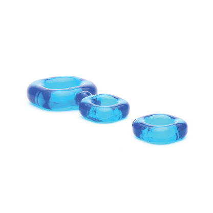 The Sport Fucker Boner Kit, featuring three transparent blue circular C-rings of varying sizes by Sport Fucker, is displayed in a row on a white background.