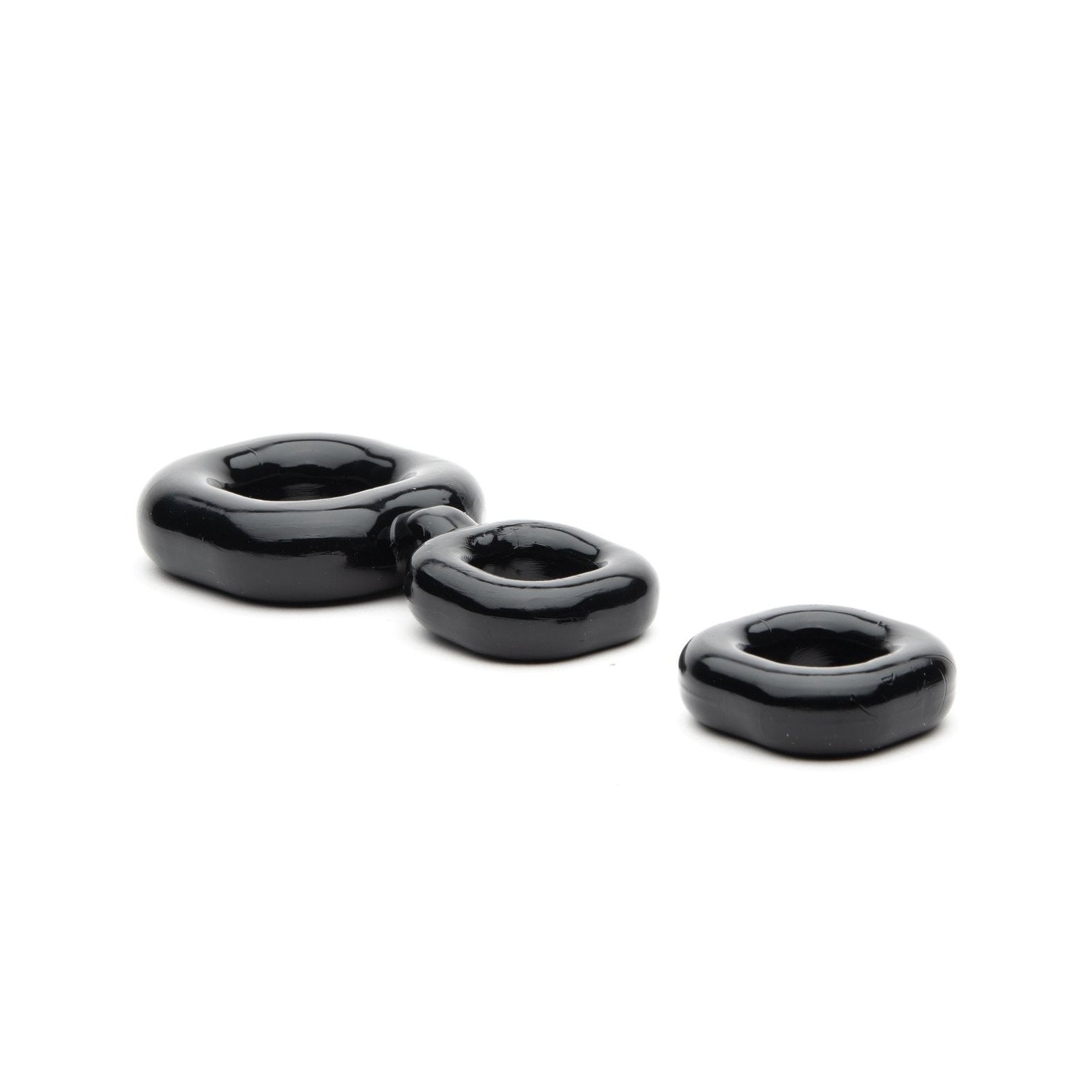 Three glossy black ceramic rings, resembling the Sport Fucker Boner Kit by Sport Fucker, are aligned on a white background with the largest ring on the left and smallest on the right.