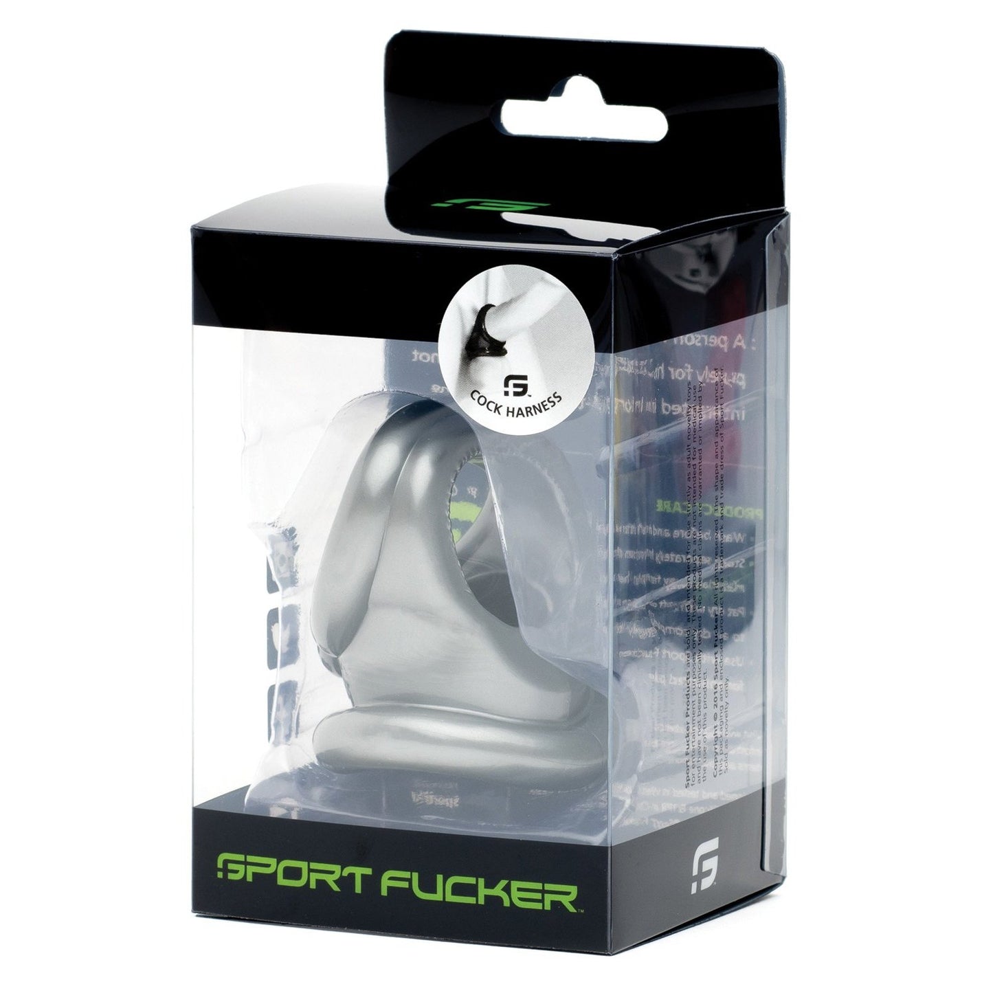 A silver Sport Fucker Cock Harness and ball stretcher made of durable TPR is displayed in a clear box with black and green accents. The packaging features the Sport Fucker brand name at the bottom, along with a round label showing a close-up of the product.