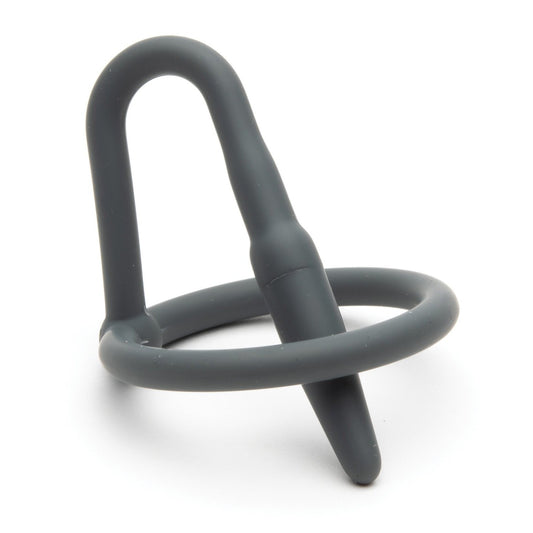 The Sport Fucker Cock Plug by Sport Fucker is a gray cock and ball ring made from medical-grade silicone, featuring an integrated butt plug. The design combines a circular ring with a tapered plug, offering functionality, comfort, and a snug fit for enhanced stimulation.