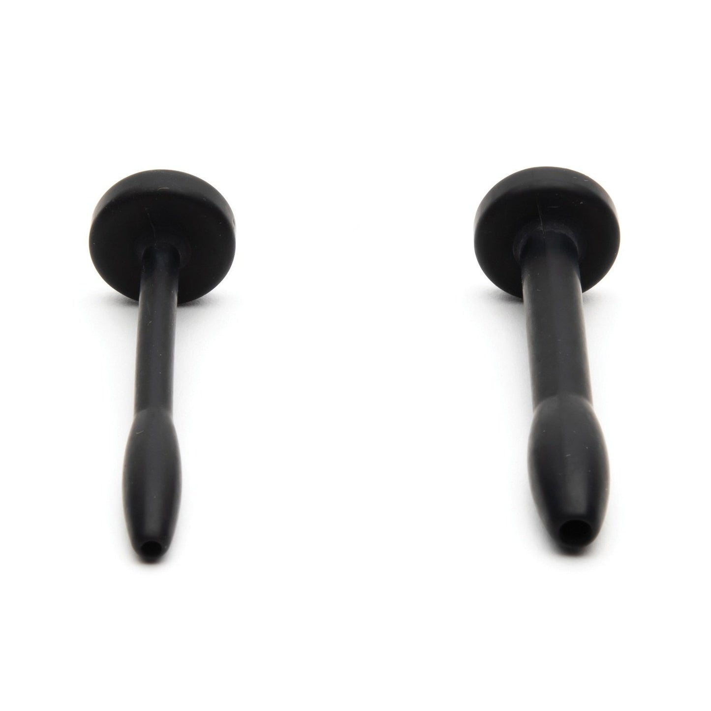 Against a white background, two black elongated rubber objects with flat ends resemble suction cups or plugs and feature rounded handles and tapered bases. They are made from medical-grade silicone, similar to the Sport Fucker Cum Plug Kit by Sport Fucker.