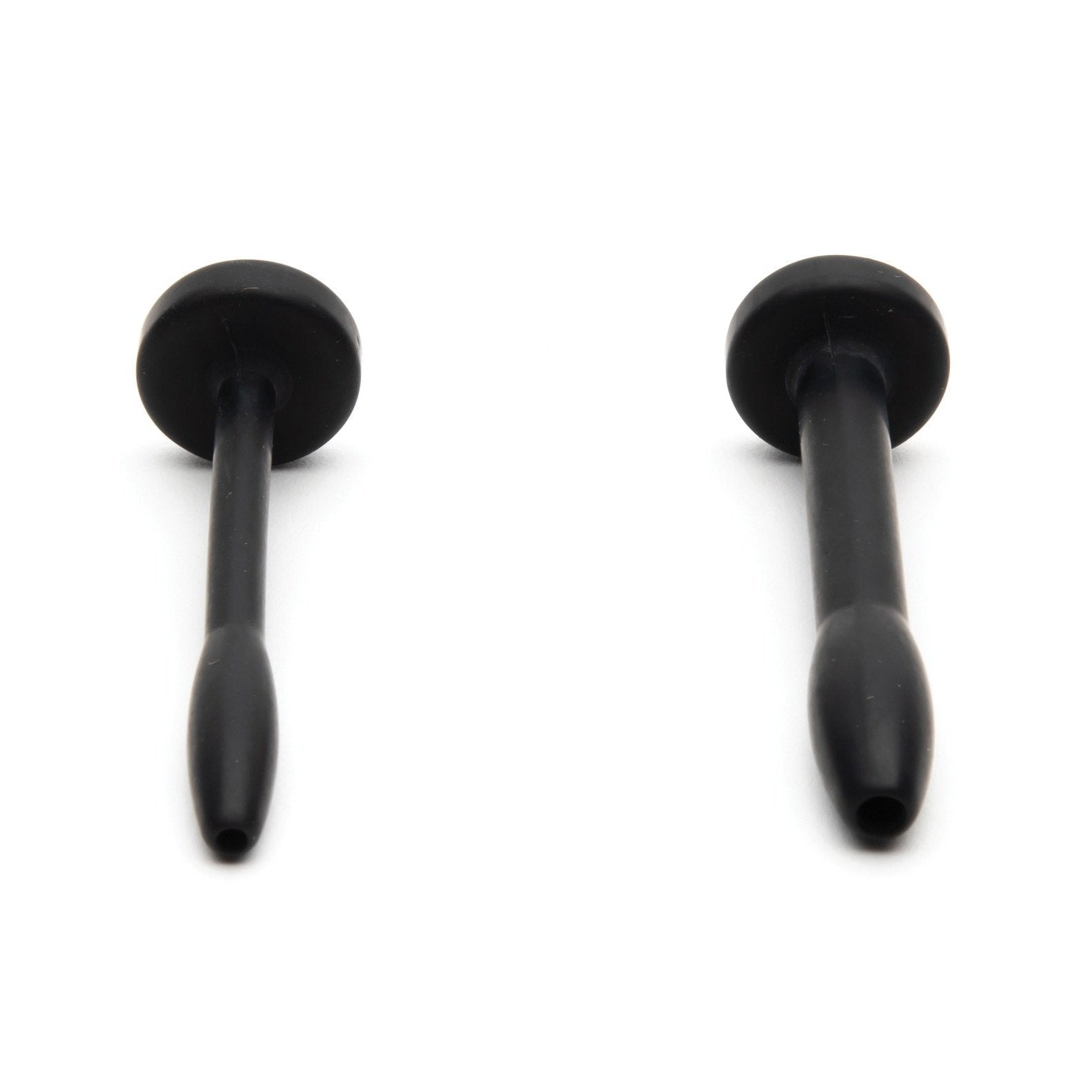 Against a white background, two black elongated rubber objects with flat ends resemble suction cups or plugs and feature rounded handles and tapered bases. They are made from medical-grade silicone, similar to the Sport Fucker Cum Plug Kit by Sport Fucker.