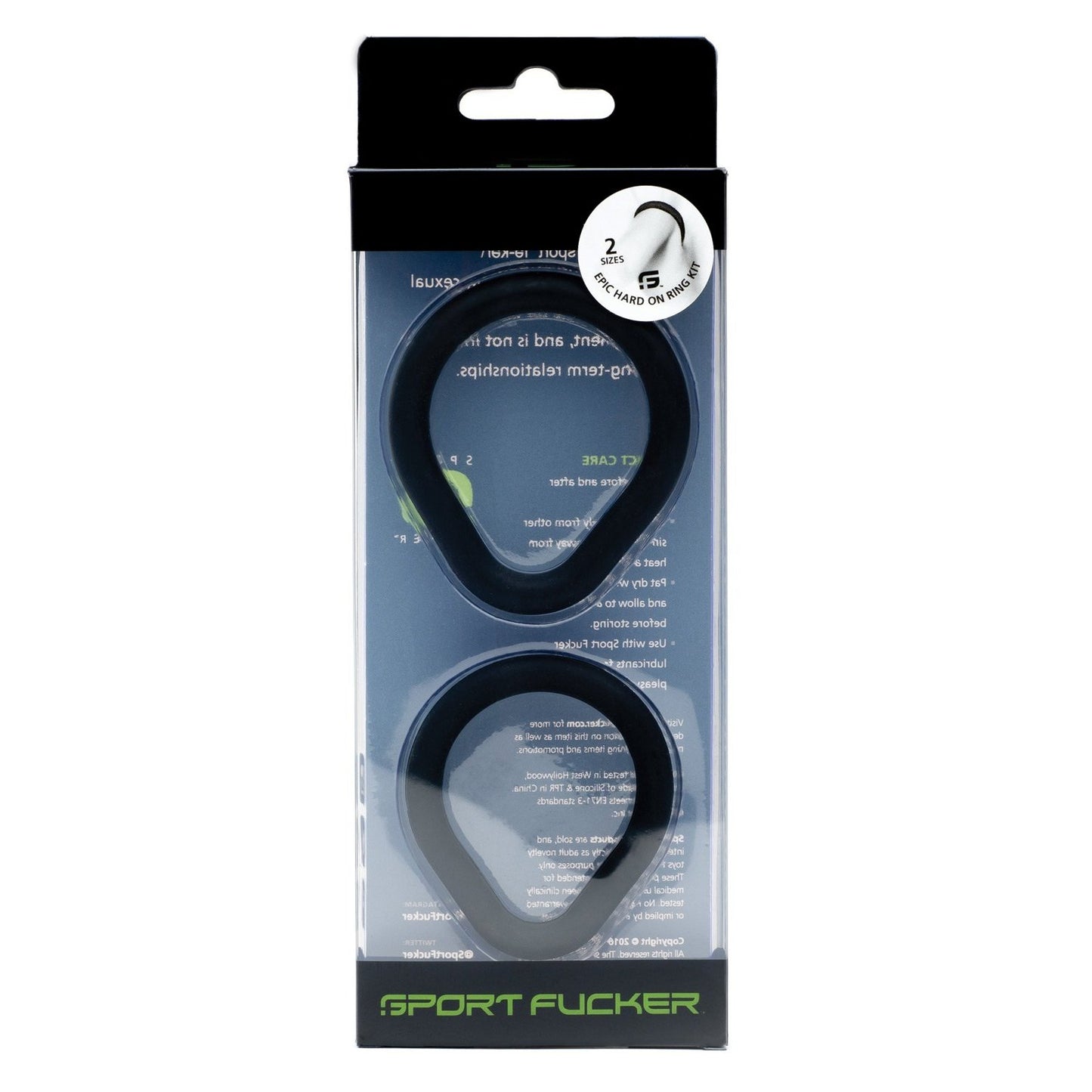 The Sport Fucker Epic Hard On Kit contains two black rubber rings with a unique oval design. The rectangular, semi-transparent packaging features text and a circular sticker stating 2 sizes, 1 pack, emphasizing the pure silicone material for superior comfort and performance.