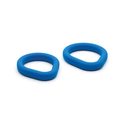 The Sport Fucker Epic Hard On Kit by Sport Fucker features two pure silicone rings with a rounded triangular shape, slightly varying in size, placed on a white background.