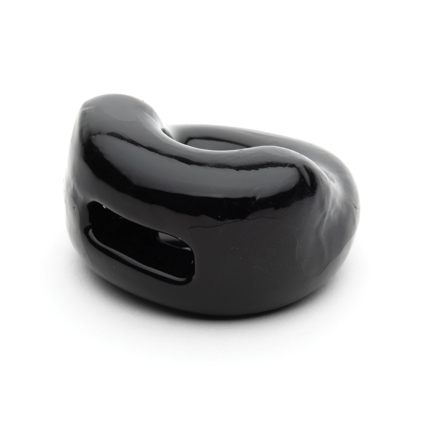 A close-up of the Sport Fucker Half Pipe, a sleek black ceramic ring by Sport Fucker with a modern curved design and dual elongated openings, is shown on a plain white background, embodying the essence of a sophisticated bulge enhancer.