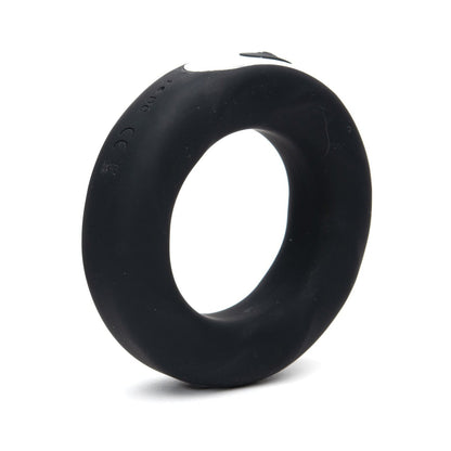 The Sport Fucker Motovibe Rev Cockring, in sleek black, crafted from medical-grade silicone with a smooth surface and a discreet side button, is likely a wearable electronic device. This USB rechargeable accessory by Sport Fucker is elegantly displayed against a plain white background.