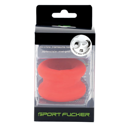 The Sport Fucker Muscle Ball Stretcher, made from soft silicone for comfort, is packaged in a clear box that showcases its innovative design, highlighting its use in physical or fitness activities.