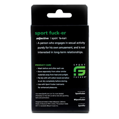 The black package for the Sport Fucker Muscle Ball Stretcher humorously defines Sport Fucker and provides care instructions. Made of soft silicone, this stretchy C-ring ensures comfort and durability. It also includes social media info and contact details for further connection.