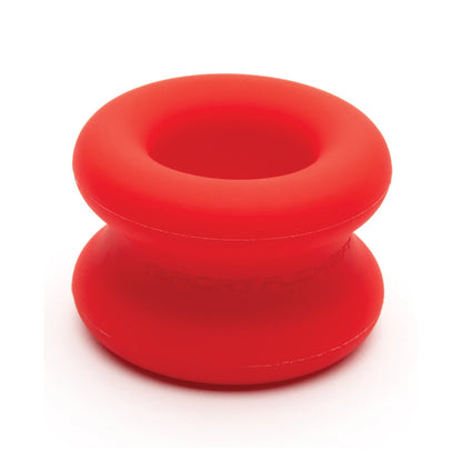 The Sport Fucker Muscle Ball Stretcher by Sport Fucker, a red, smooth silicone ring possibly used for fitness or massage, is shown against a white background.