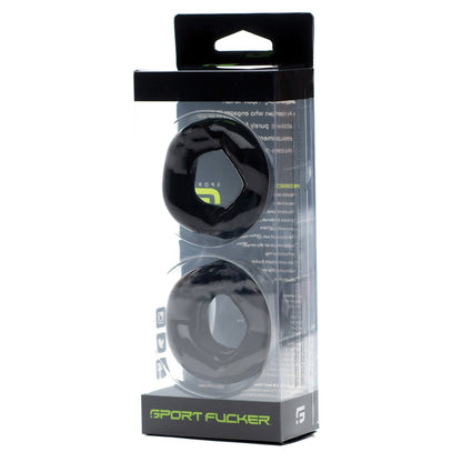 The Sport Fucker Revolution Combo Set by Sport Fucker includes two black rubber donut-shaped rings in a clear box, doubling as a cockring and ball stretcher for enhanced performance and an exhilarating experience.