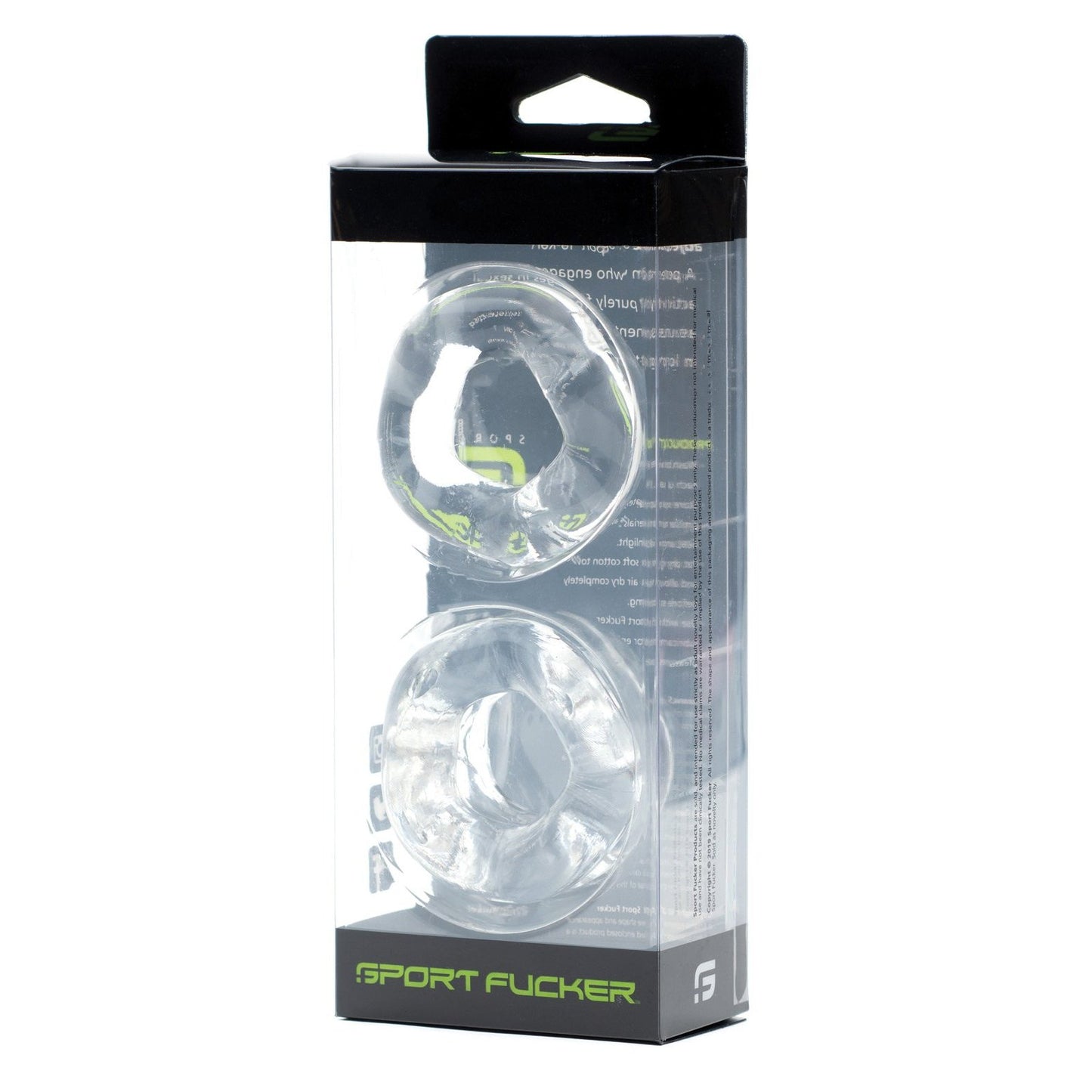 The Sport Fucker Revolution Combo Set comes in a clear plastic box featuring two vertically stacked transparent silicone rings. The packaging displays black and green branding with Sport Fucker labels, emphasizing its dual role as a cockring and ball stretcher.