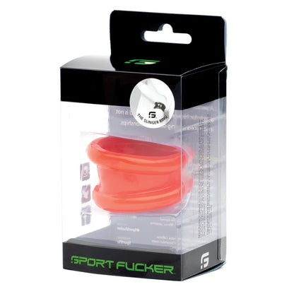 The image shows a transparent box containing the red silicone Sport Fucker Slinger Ring. The packaging includes several texts and the brand logo, with Sport Fucker clearly featured at the bottom, suggesting its an accessory for sports or fitness enthusiasts.