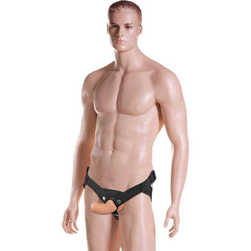 A male mannequin showcases the Sportsheets Everlaster Harness Stud, featuring a black design with a beige front attachment for comfort and style, against a plain white background.