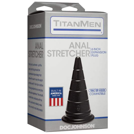The image displays the TitanMen 6 Anal Stretcher packaging—a ribbed expansion plug designed for pleasure. The gray box with blue accents sports product text and a Built in America label featuring an American flag. Its hypoallergenic, phthalate-free, ensuring safety and satisfaction.