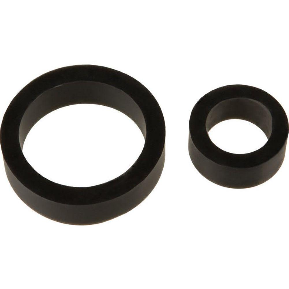 Two TitanMen Platinum Silicone Cock Rings, one larger and one smaller, rest on a white background. The black rings have sleek designs with hollow centers and are made from body-safe silicone.