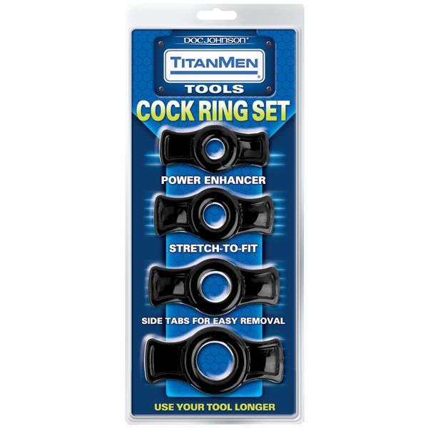 A blister pack of Titanmen Tools Cock Ring Set by TitanMen, featuring four stretchy black rings for enhancing erection strength, with power enhancers and side tabs for easy removal. Packaging highlights benefits and displays each ring vertically.